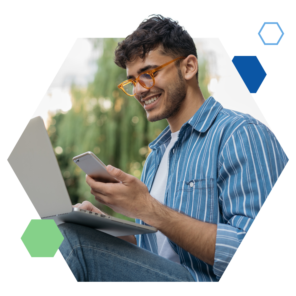 a man holding a laptop